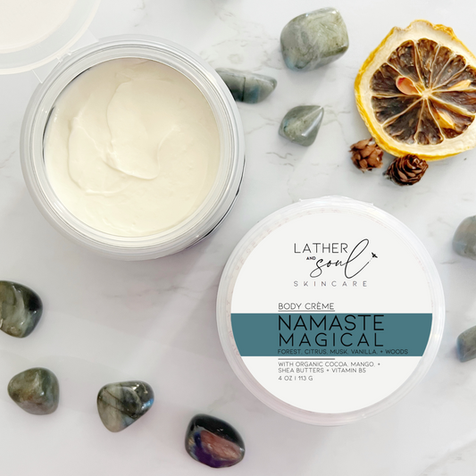 Luxurious body crème by Lather and Soul Skincare on white table surrounded by labradorite crystals, in Namaste Magical scent