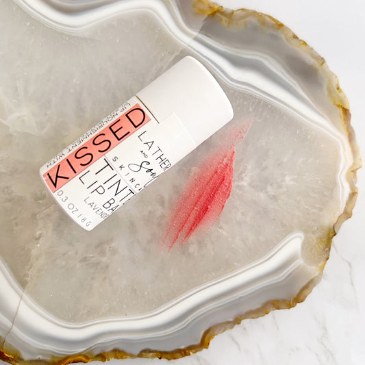 "Kissed," rose gold organic tinted lip balm in paperboard tube from Lather and Soul