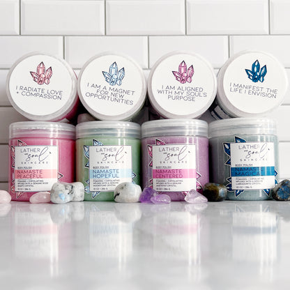 A collection of crystal infused body scrubs from Lather + Soul.