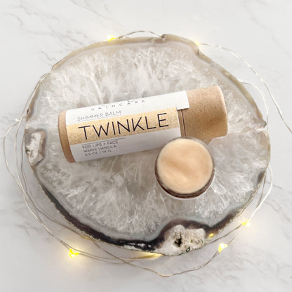 "Twinkle" organic lip balm stick gold highlighter from Lather and Soul for both lips and face.