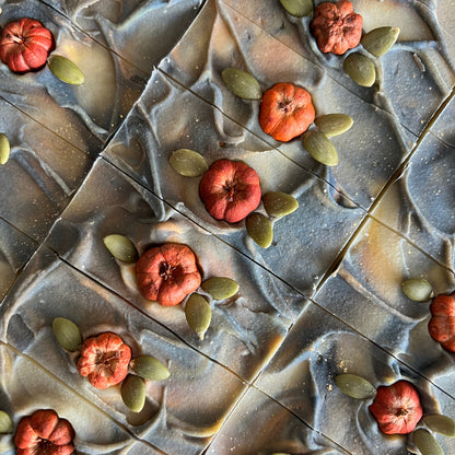 Handmade soaps with decorative pumpkin  pods and pumpkin seeds from Lather and Soul