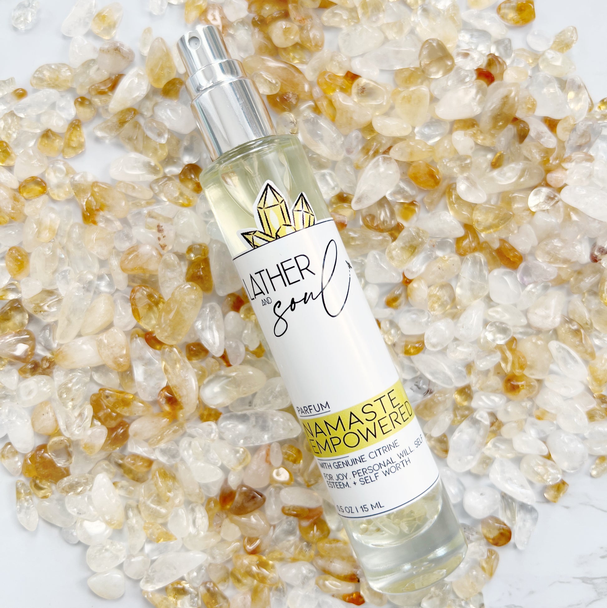 Bottle of 'Namaste Empowered' perfume infused with citrine crystals 