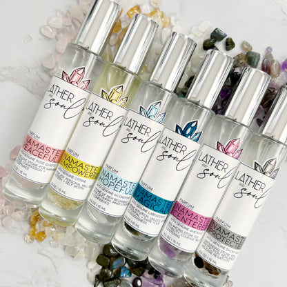 Row of Lather & Soul parfum bottles with infused with real crystals 
