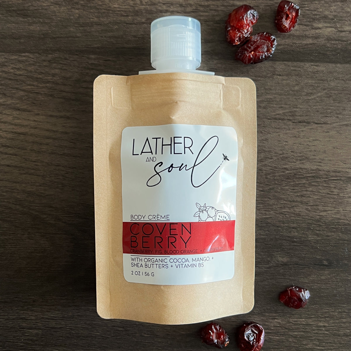 Luxurious body crème packaged in eco-friendly kraft pouch in Covenberry cranberry and fig scent.