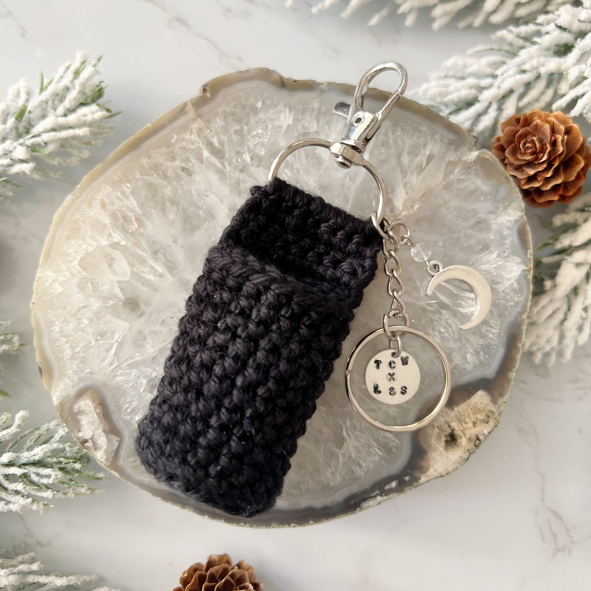Black crochet lip holder and keychain with charms from Lather and Soul
