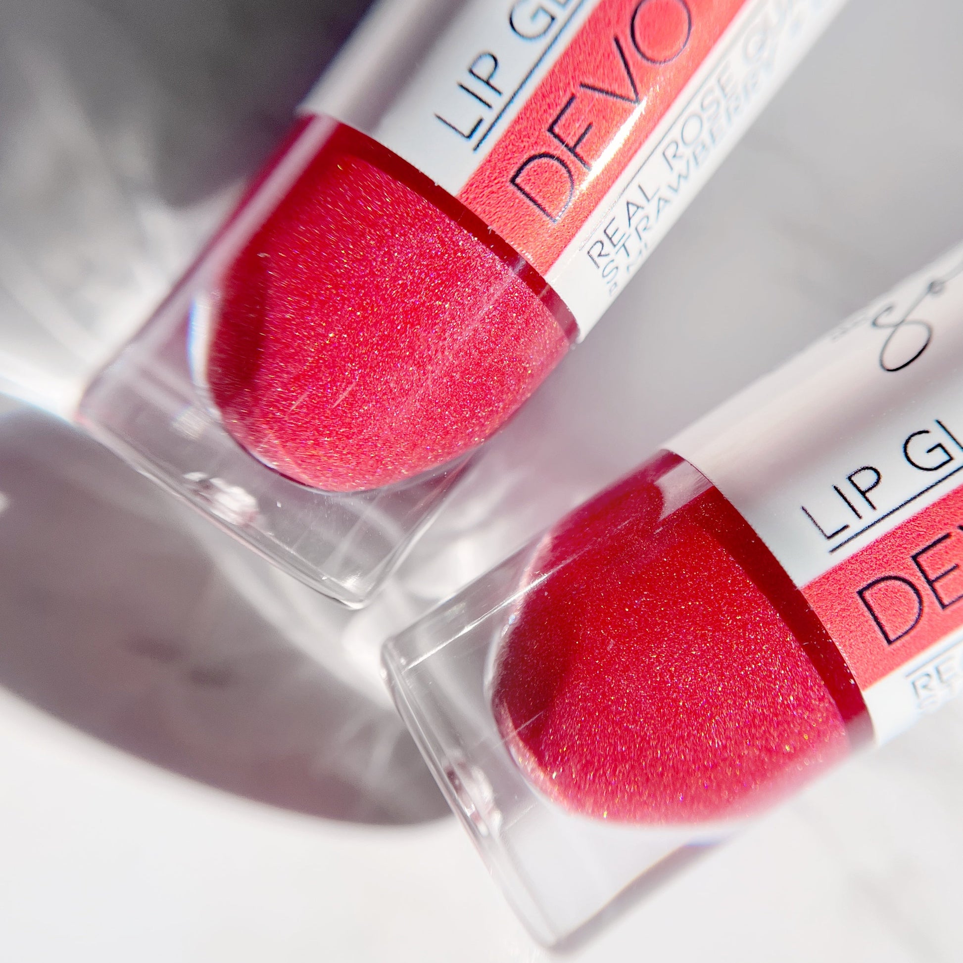 NEW "Devotion" crystal infused lip gloss in strawberry and cream scent!
