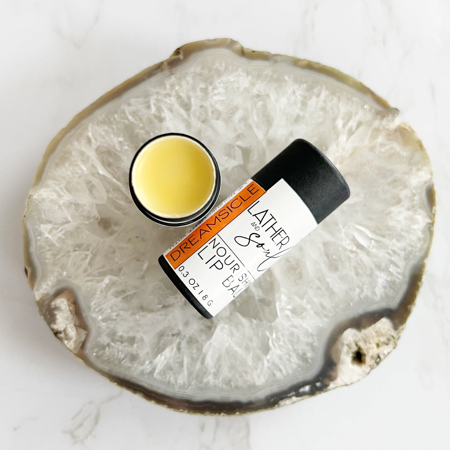 "Dreamsicle" nourishing lip balm in orange cream scent