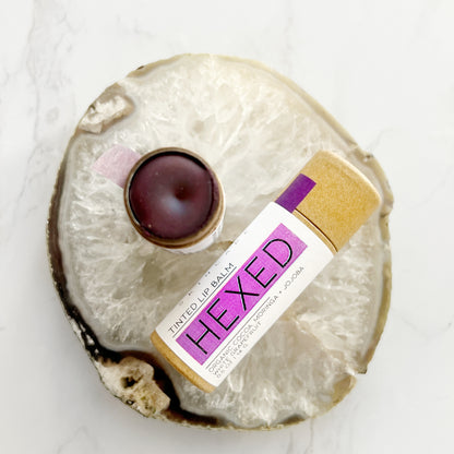Purple tinted lip balm from Lather + Soul, "Hexed."
