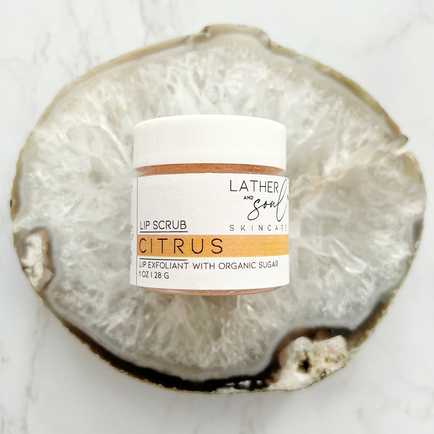 Citrus lip scrub made with organic ingredients by Lather + Soul.