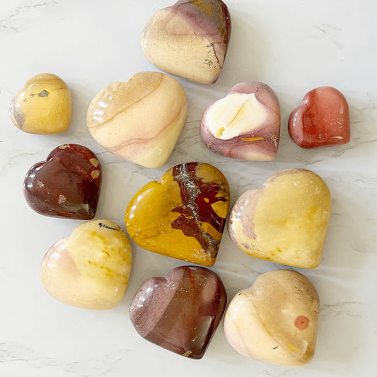 A collection of mookaite crystal hearts