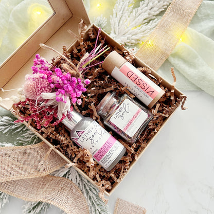 Holiday gift set with perfume, tinted lip balm, botanical facial steam, and mini floral bouquet 