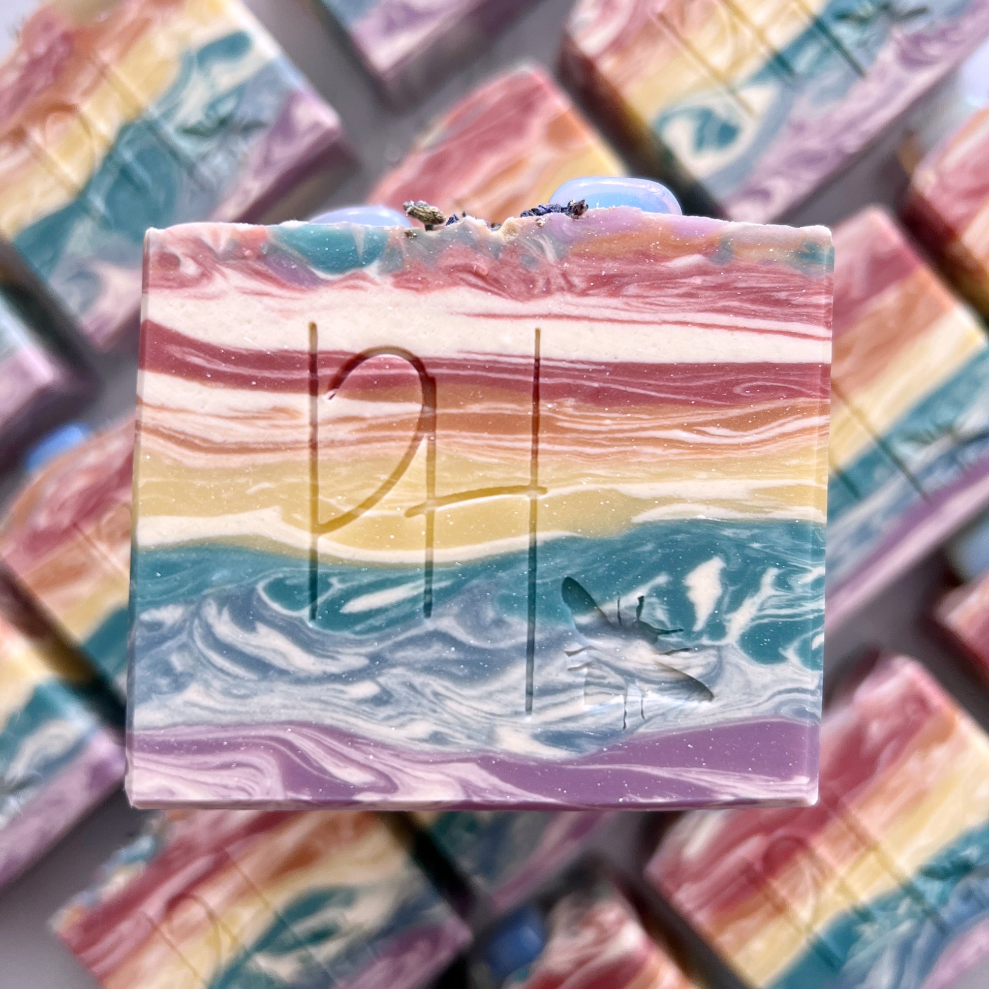 Pride Month rainbow soaps with opalite crystals with portions donated to the Trevor Project