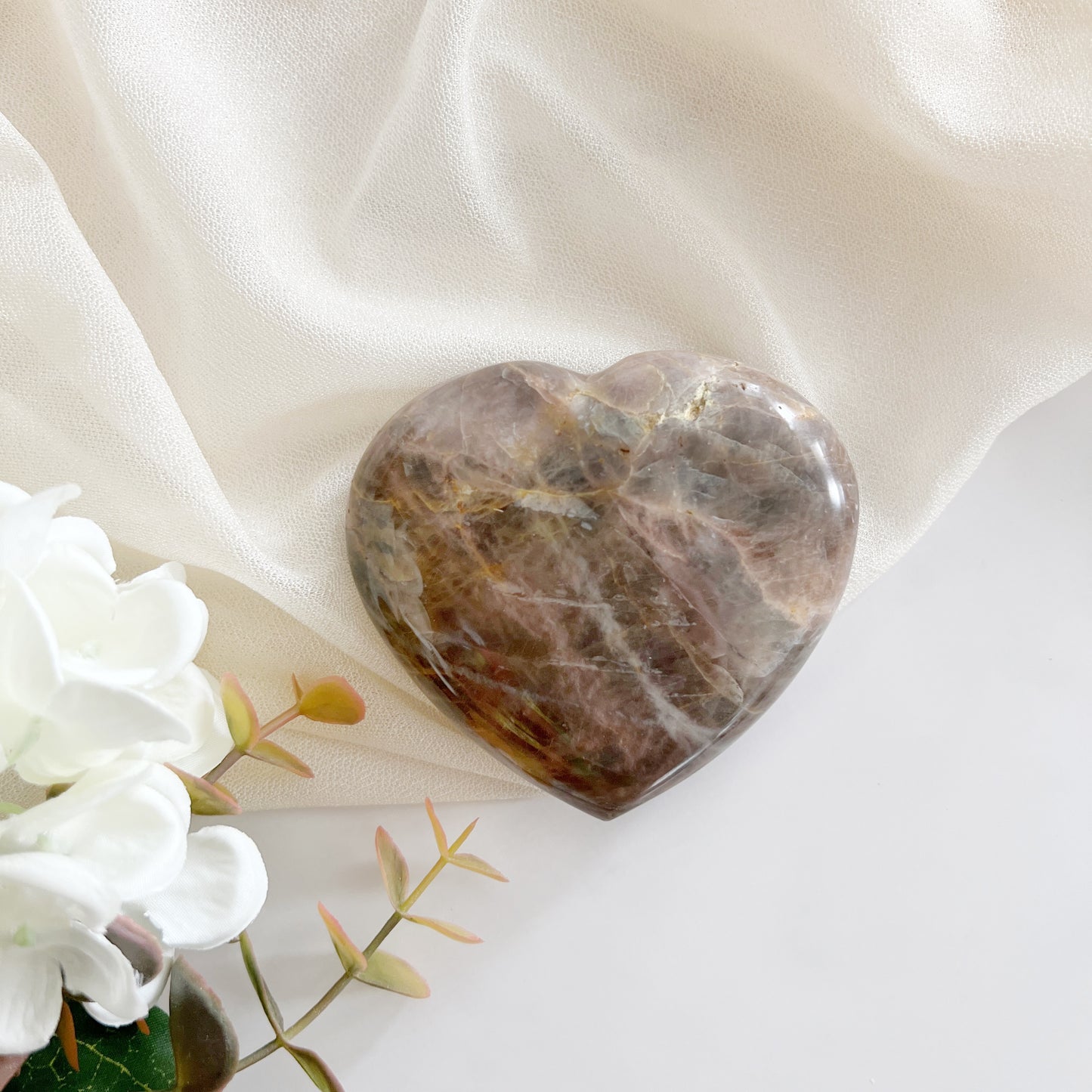 Black moonstone heart for enhancing intuition, psychic abilities, and emotional balance.