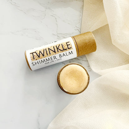 "Twinkle" organic lip balm stick gold highlighter from Plainville Homestead for both lips and face.