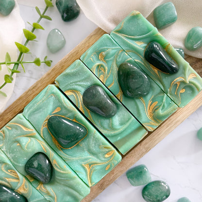 Green artisan crystal soap, the bar is decorated with a genuine green aventurine crystal.