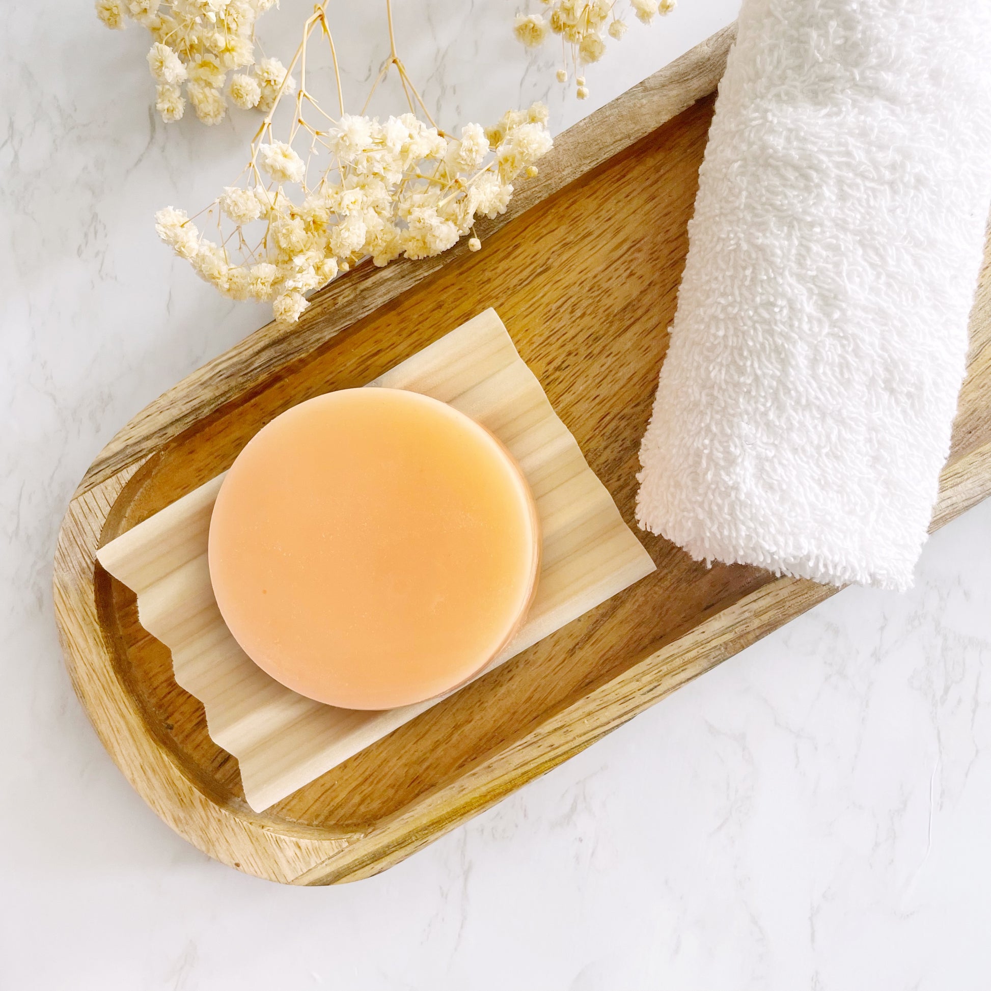 Homemade conditioner bar with concentrated ingredients by Lather and Soul Skincare.